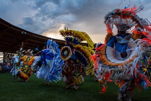 Indigenous dancers in ceremonial dress