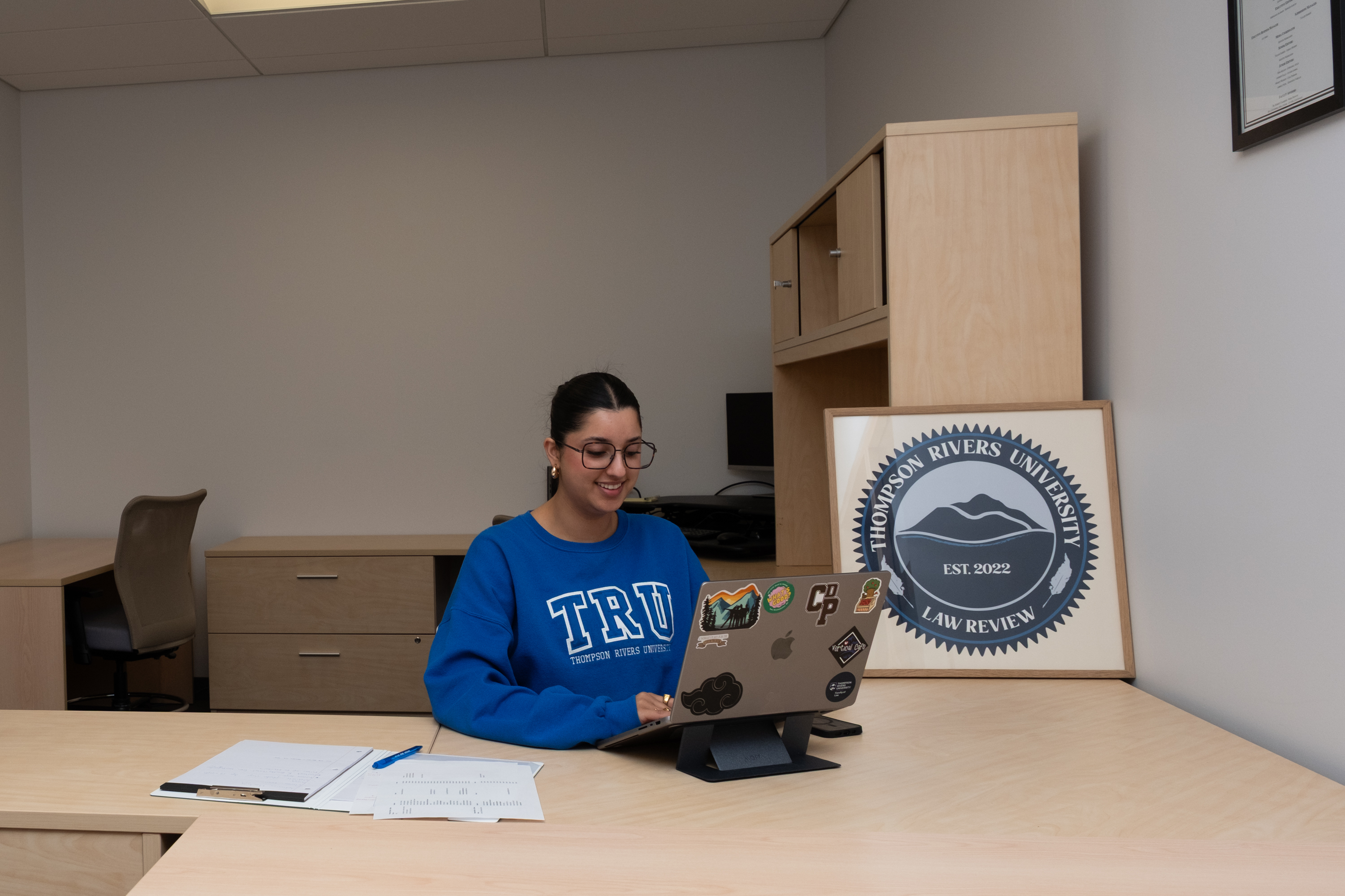TRU JD student working on her research.
